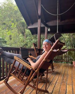 study abroad student in hammock porch