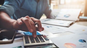 Business professional using a calculator