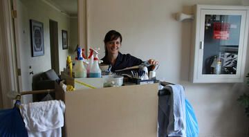 hotel staff with housekeeping cart