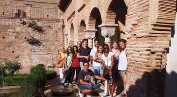 High school group posing under arch in Granada