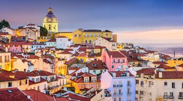 colorful houses along lisbons coast sunset