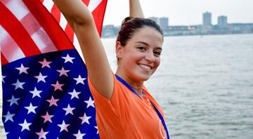 hsusa student holding american flag in NYC harbor