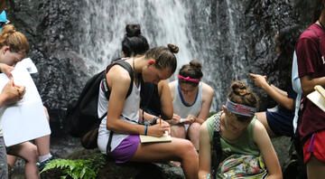 monteverde_students-sitting-in-the-nature-listening.jpg