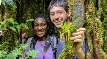 monteverde-two-students-standing-among-cloud-forest-trees