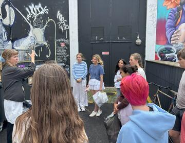 Learning about the recycling center with our instructor Josephine!