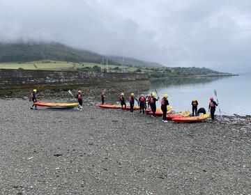 Students prepare the kayaks