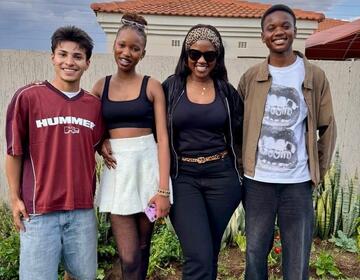 Picture of Aniuas Sanchez with the host family.