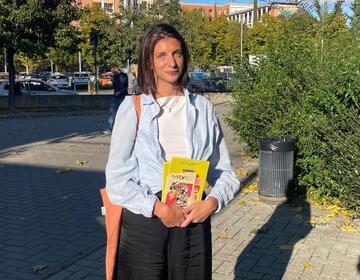 Diana Biagini (Program Coordinator) promoting the Festival dei Popoli by distributing leaflets in Florence's outlying neighborhoods.