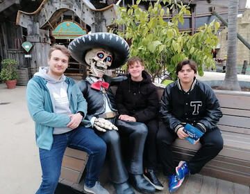 Thomas (second from right) and his host brothers hang out with a ghoulish friend.