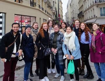 High school students smiling on excursion in Paris