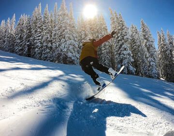 A BridgeUSA participant snowboards down a mountain in Vail, Colorado.