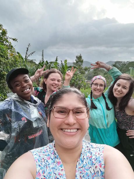 Students taking a group selfie in Monteverde forest