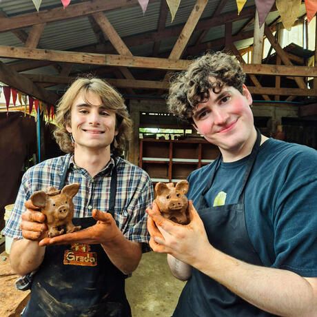 santiago-ch-two-students-holding-pottery