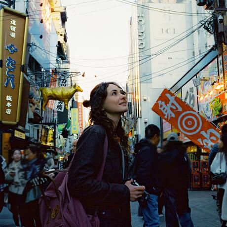 osaka-woman-with-camera-busy-street