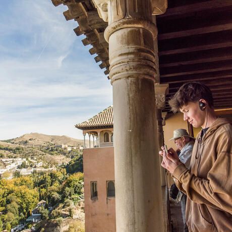 seville-hsa-male-student-taking-picture-granada-cityscape