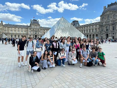 Group of high school summer students in front of the Louvre