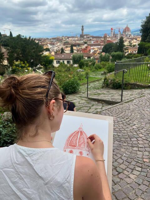 Student drawing building in Italy