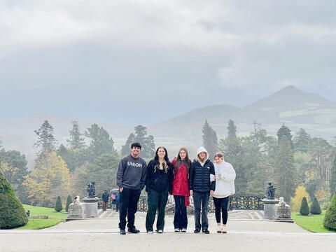 High school students in Ireland posing in front of estate