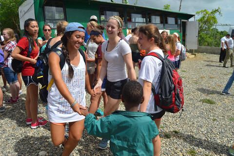 high-school-students-playing-with-kids-dominican-republic
