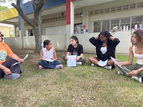 high school study abroad students interacting with kids at school 