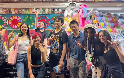 High school summer students having fun in Asian store abroad