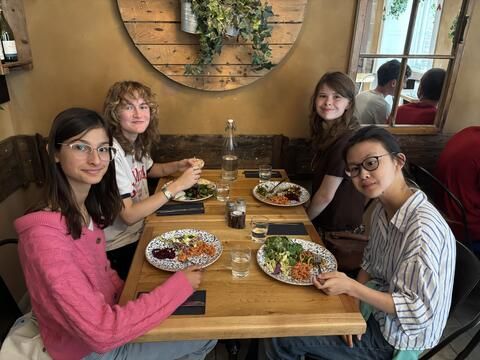 Students eating lunch at Mediterranean restaurant 