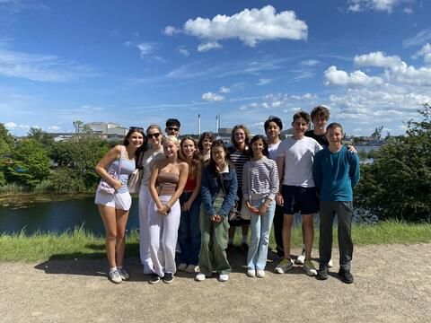 Students beside canal in Copenhagen during walking tour 