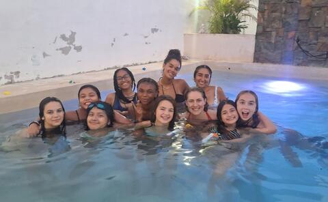 A group of HSSA students in a swimming pool
