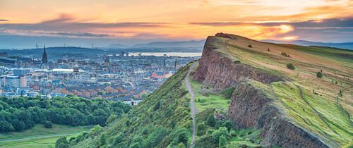 Edinburgh Salisbury Crags in Holyrood Park and downtown Edinburgh