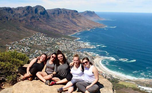 students on cape town cliff