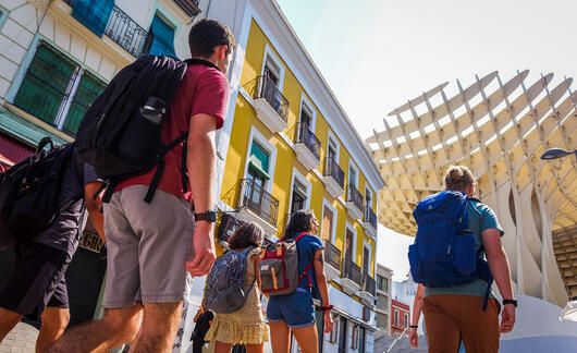 Seville students walking with backpacks