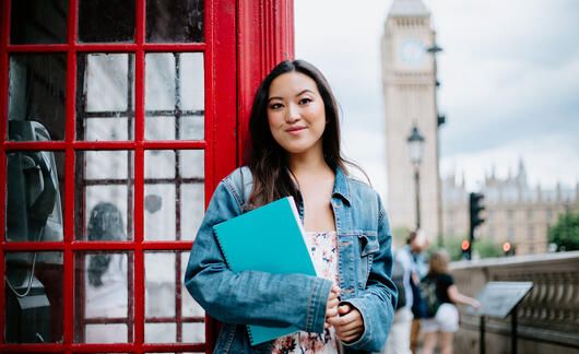London student standing near phone booth