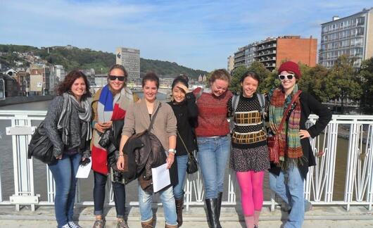 Students pose on bridge during excursion to Liege, Belgium