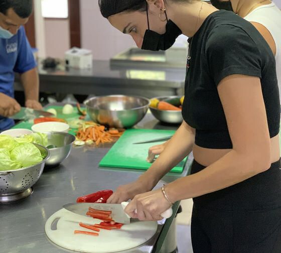 student cutting pepper abroad monteverde