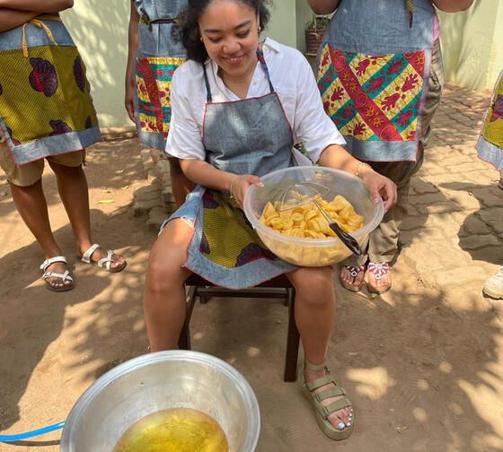Legon student frying plantains