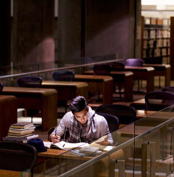 college student studying in a library