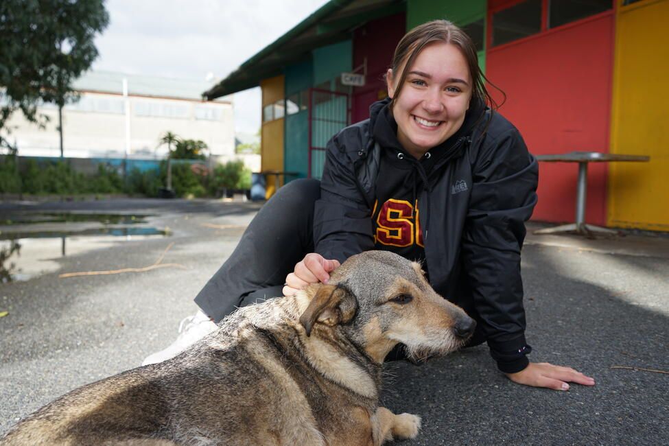 Jordyn here pictured with one of the dogs that hangs out at her Internship Site 