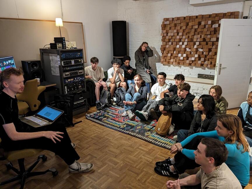 Students inside an audio recording studio