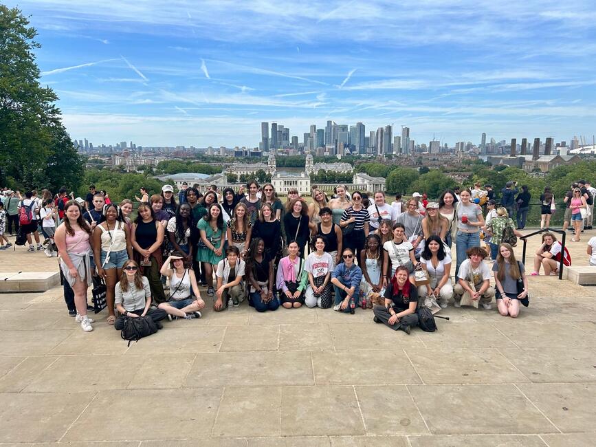Students posing in front of the beautiful London skyline