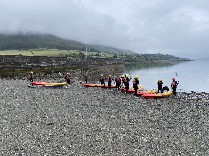 Students prepare the kayaks