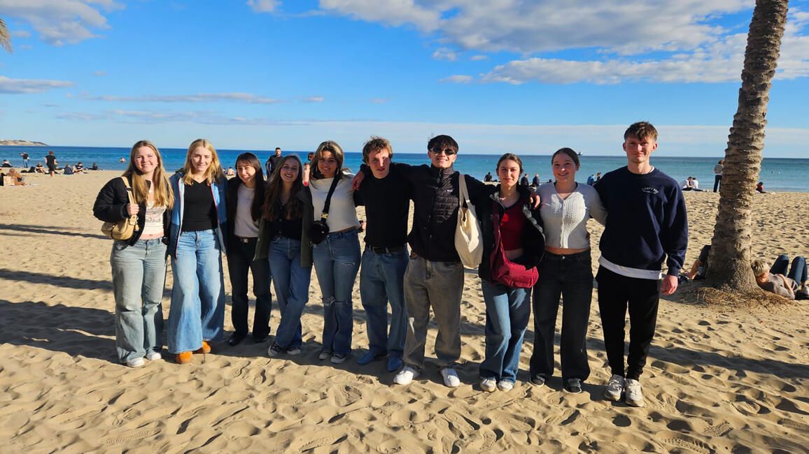 High school students in Alicante posing on beach