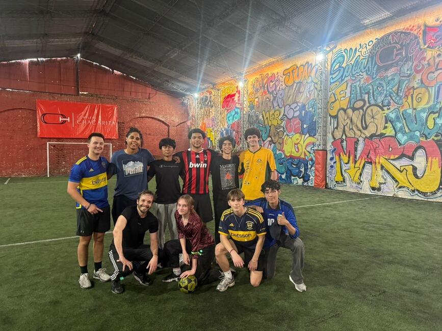 Global Navigators pose on the soccer pitch after an afternoon of scrimmaging.