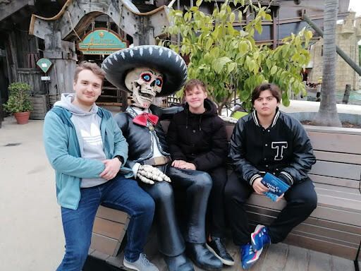 Thomas (second from right) and his host brothers hang out with a ghoulish friend.