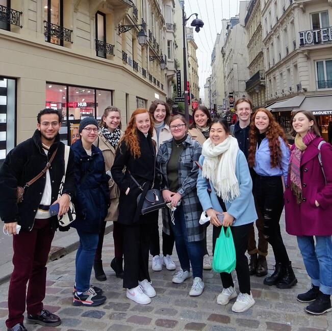 High school students smiling on excursion in Paris
