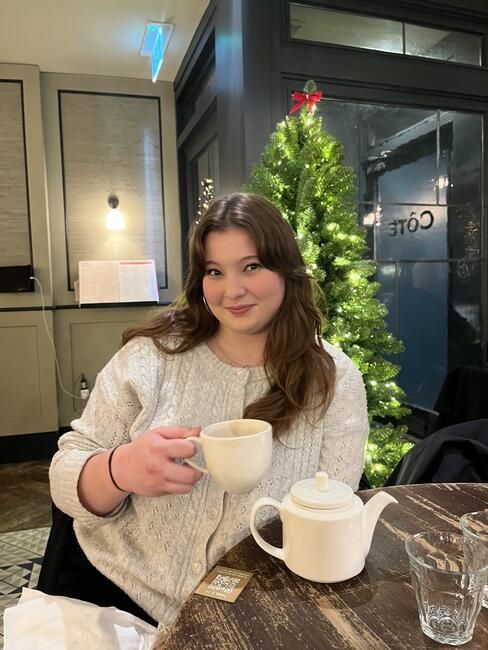 Student enjoying coffee at a nearby cafe in Berlin.
