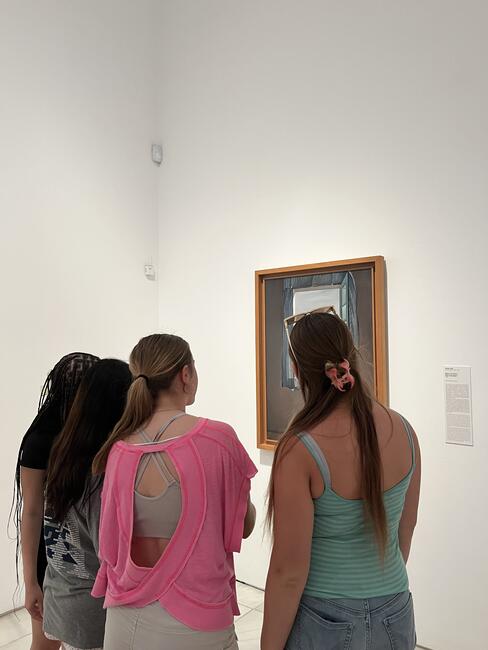 Students looking at art in museum