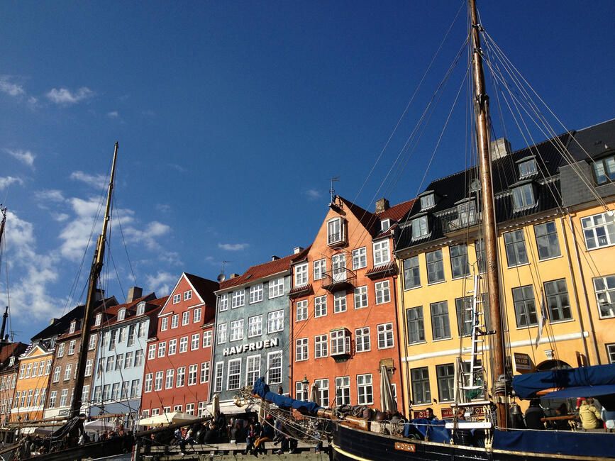 copenhagen boats in canal multicolored buildings behind