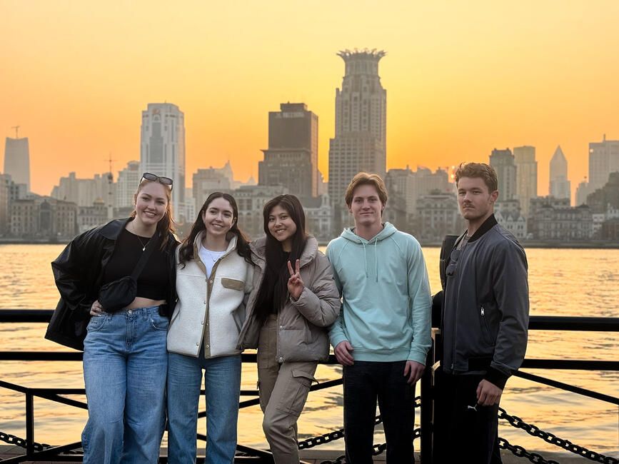 shanghai students in front of the city skyline