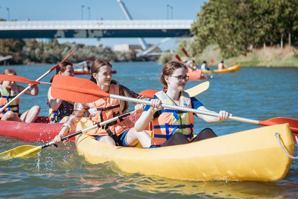 Summer abroad in Seville students on kayaks on-the guadalquivir river 