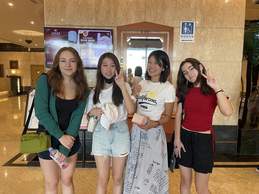 High school summer abroad students posing in front of elevator